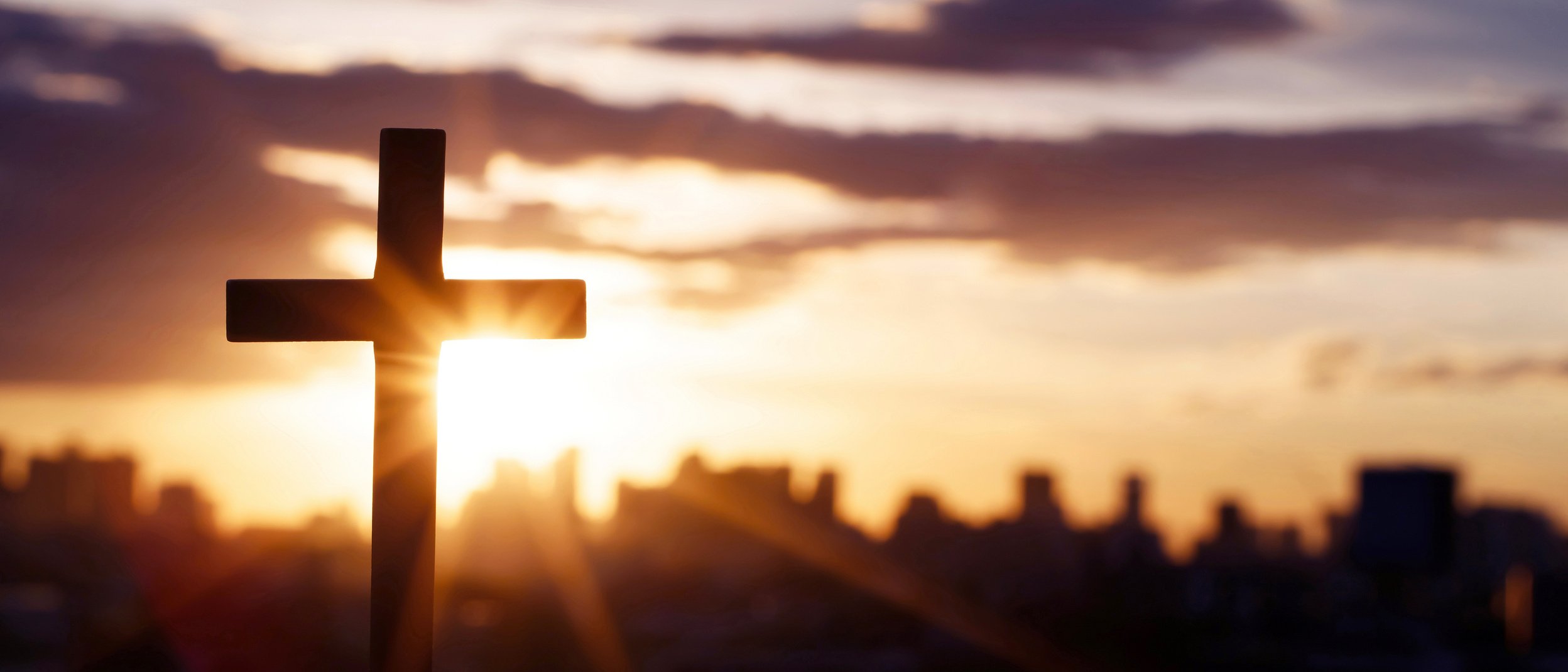 Silhouette of a Cross at Sunset